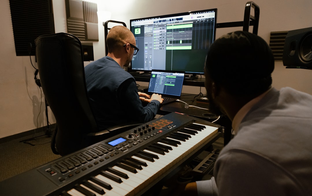Two men working in a music studio
