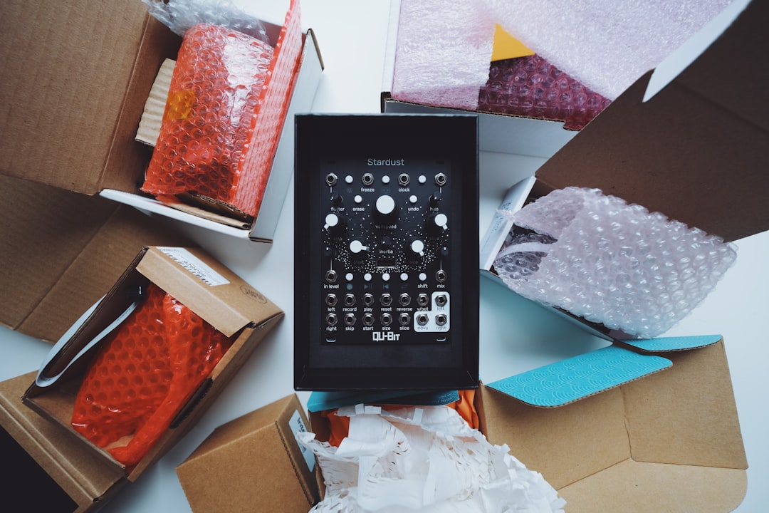 Unboxing a new audio mixer surrounded by packaging materials