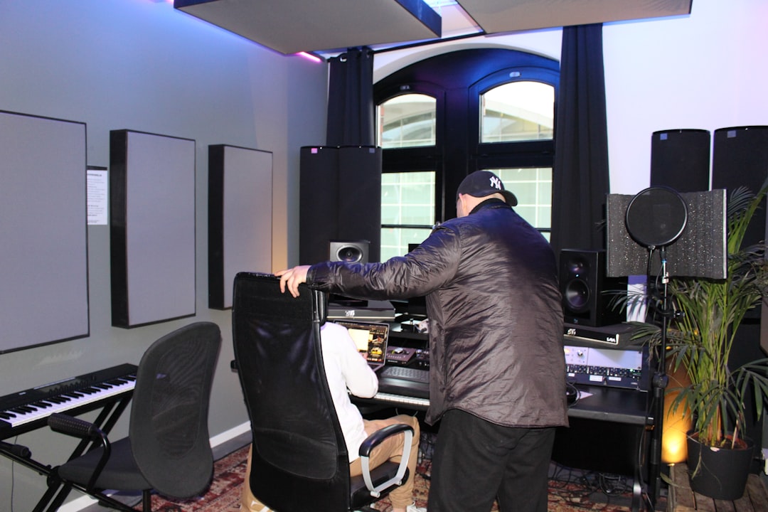 A man standing in front of a keyboard in a room