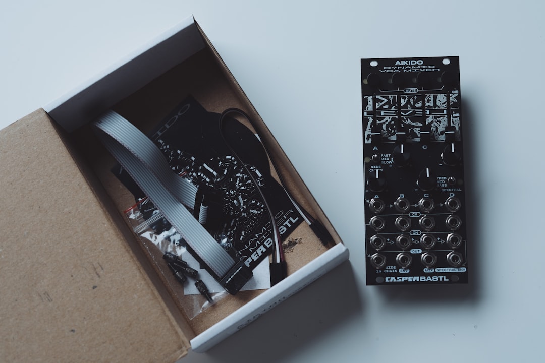 Electronic module and components in an open box.