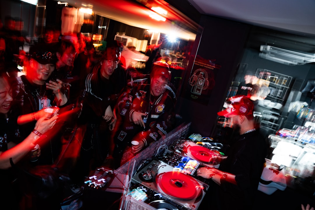 Dj playing music for a crowd at a concert