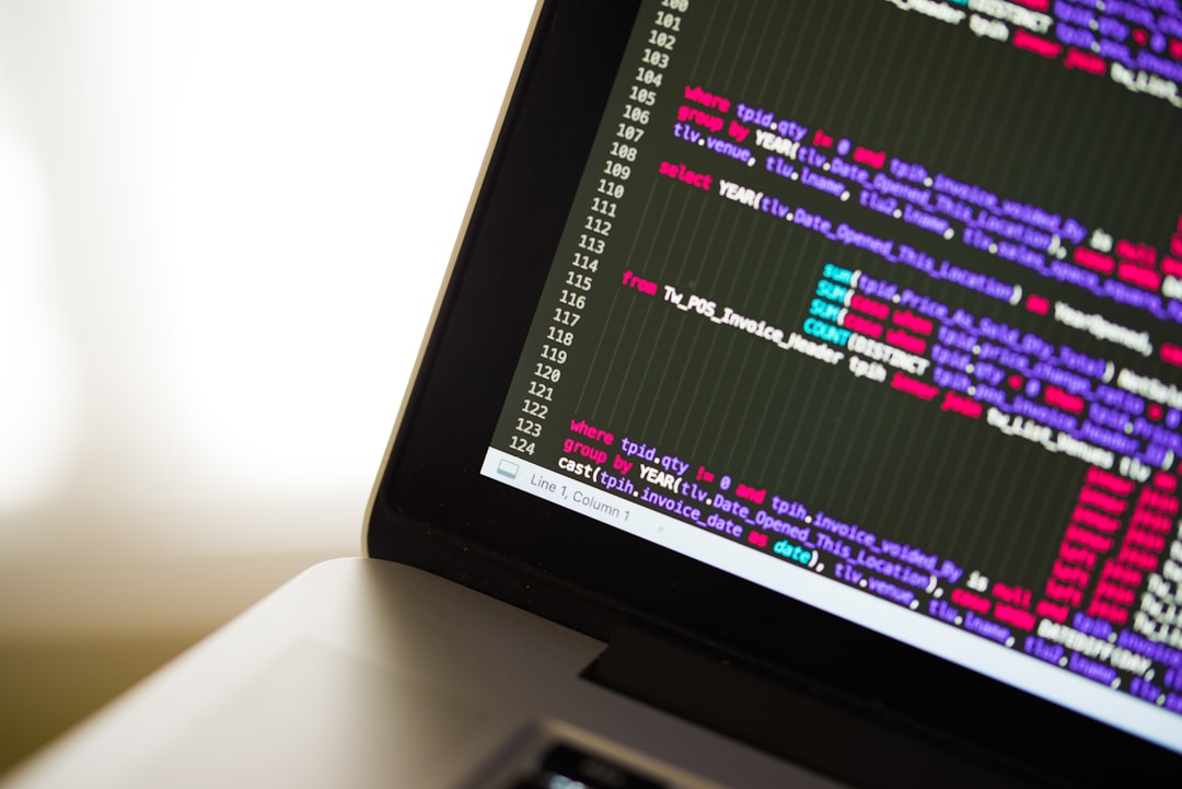 Black and gray laptop showing programming language