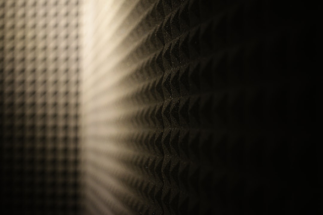 Acoustic foam panels create shadow and texture.