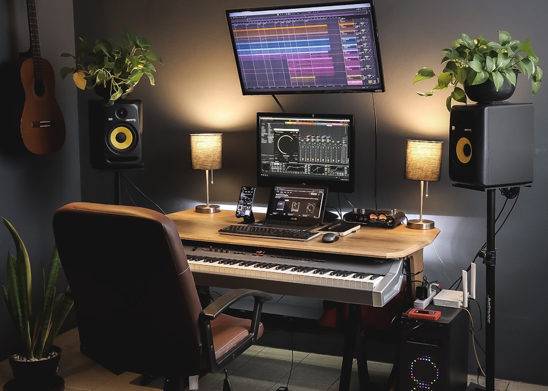 A desk with a keyboard and a monitor