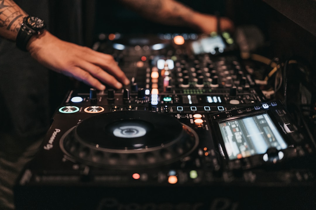 Person playing dj controller in a room