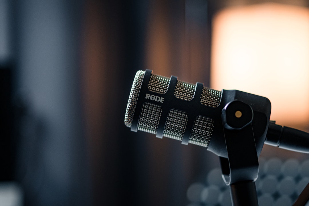 A close up of a microphone with a light in the background