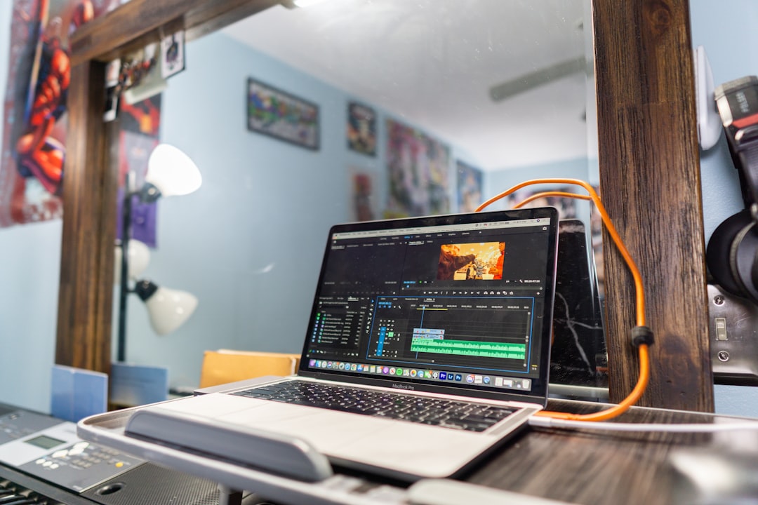 Macbook pro on brown wooden table