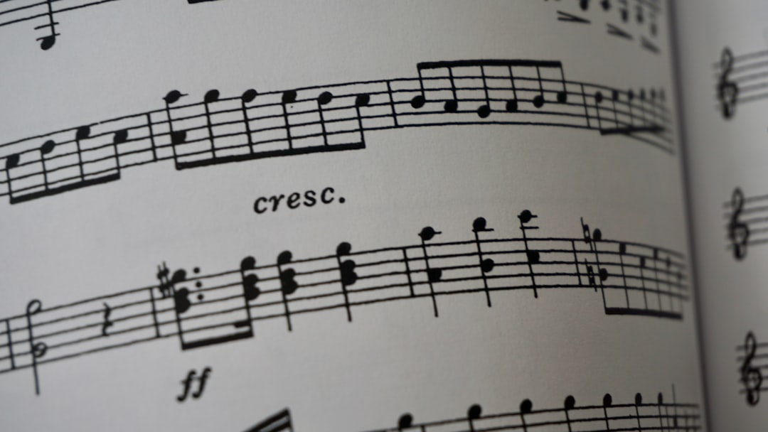 A close up of a book with musical notes