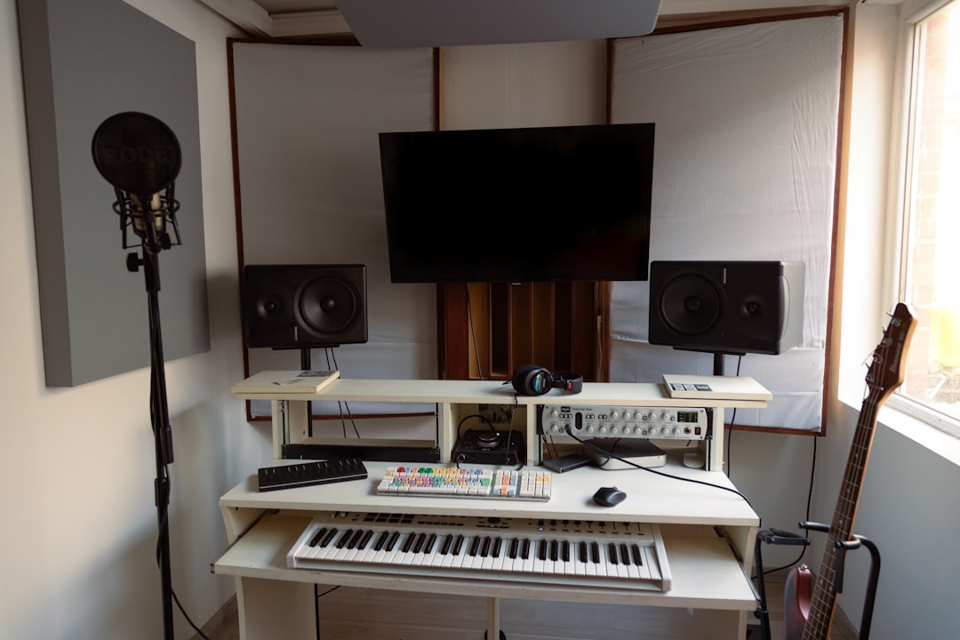 Recording studio with keyboard, microphone, and guitar