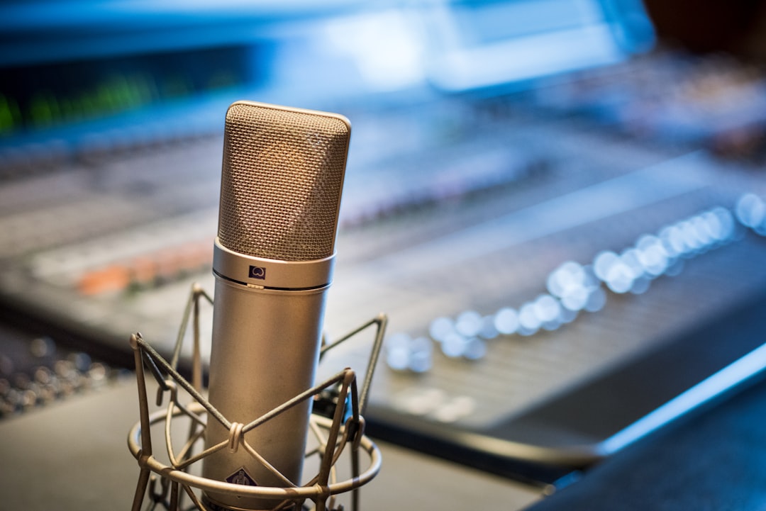 Silver microphone near audio mixer
