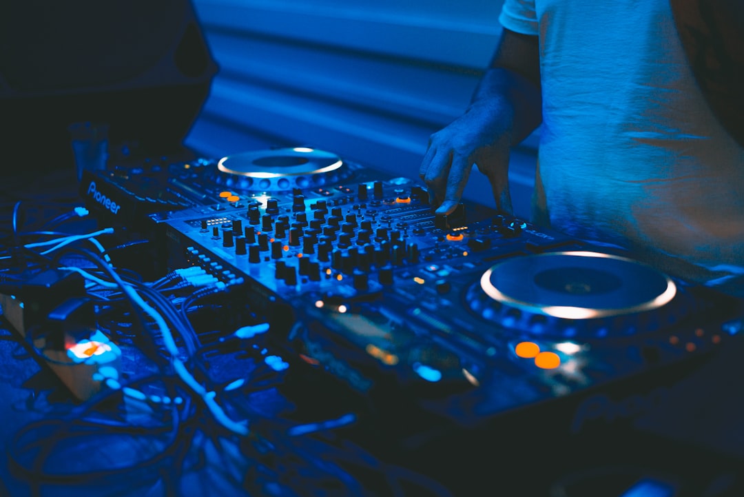 Person using black DJ controller
