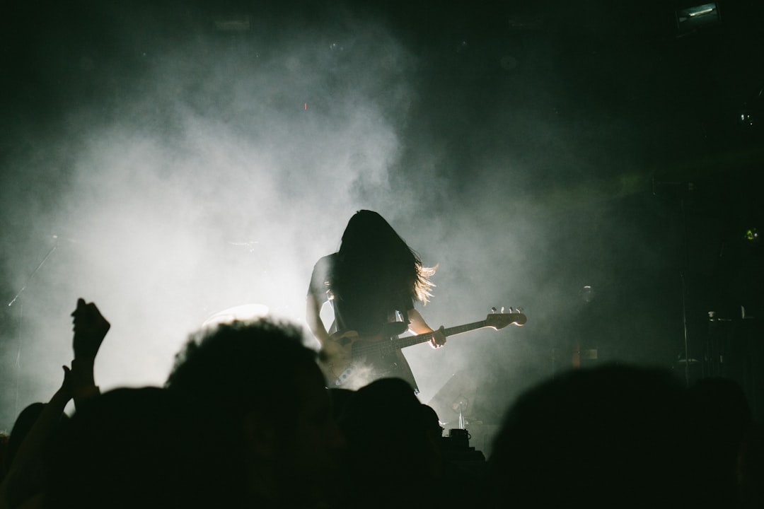 Person playing electric guitar